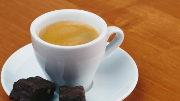 Cup Of Espresso With Candy