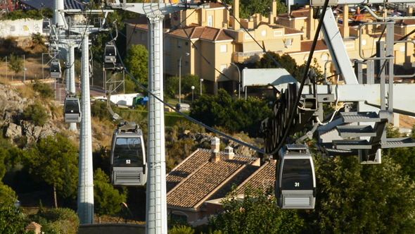 Cable Car Running with Town and Sea at Background