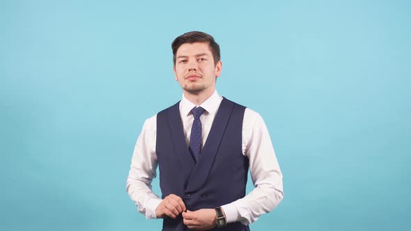 Portrait of Gentleman Witn Flowers Isolated Over Blue Background