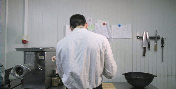 A Cook Prepares in the Kitchen