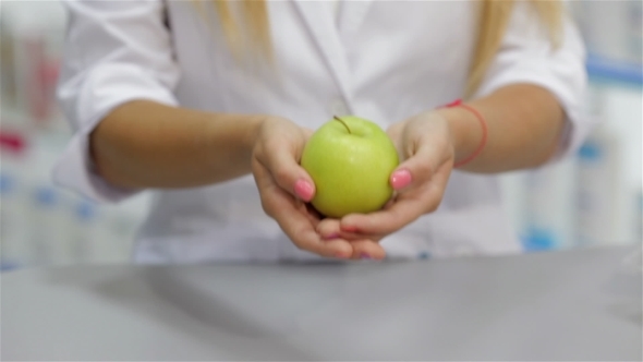 Pharmacist Holding An Apple alt