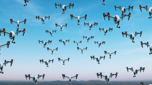 Group of UAV Drones Flying in Sky