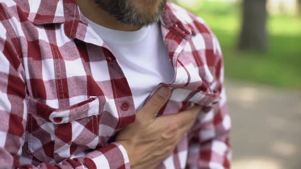 Middle-Age Male Feeling Strong Chest Pain, Sensation of Tightness, Heart Attack