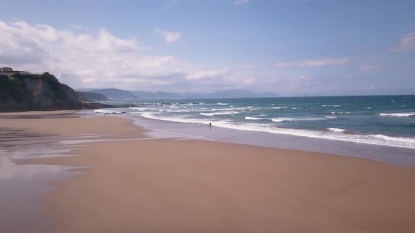 Smooth drone view at Sopelana Beach in Basque Country Spain. 4K ProRes