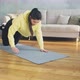 Lady in Color Hoodie Does Push Ups Standing on Knees at Home - VideoHive Item for Sale