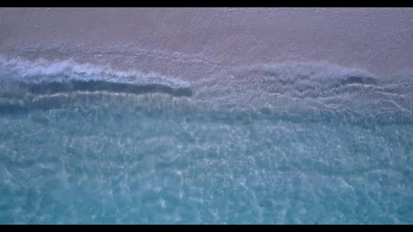 Aerial drone shot abstract of exotic sea view beach vacation by turquoise sea with white sandy backg