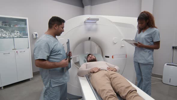 Doctor Talking to Patient before CT Scan