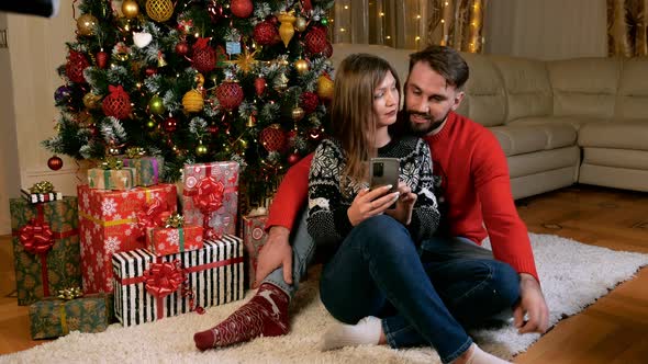 Multiethnic Couple Checks Social Networks Feed