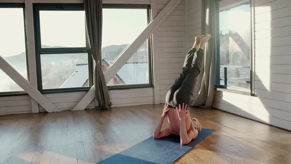 Mature Man Amongst Doing Power Yoga Exercises