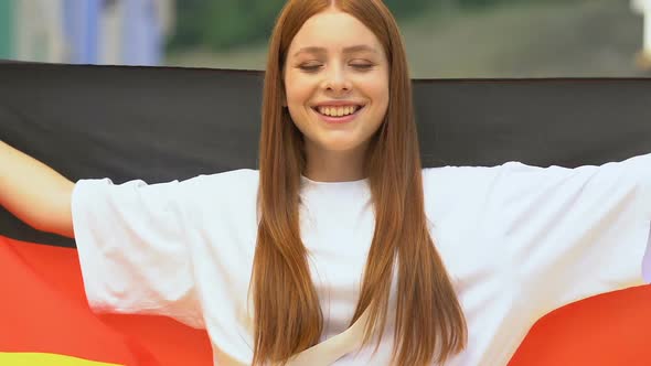 German Flag in Female Hands, Pretty Teenager Feeling Proud of Country, Nation