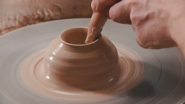 Pottery - the Master Is Continuing To Spin Clay on the Wheel