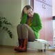 Woman Sit on Radiator and Froze Feet Turn More Heat in Room - VideoHive Item for Sale