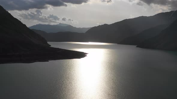 The Sun From the Natural River Waterfall in the Mountains in a Magical Sunset