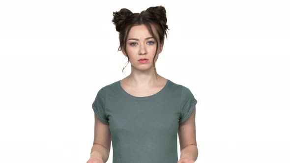 Portrait of Determined Woman 20s with Double Buns Hairstyle Crossing Arms in Rejection and Saying No