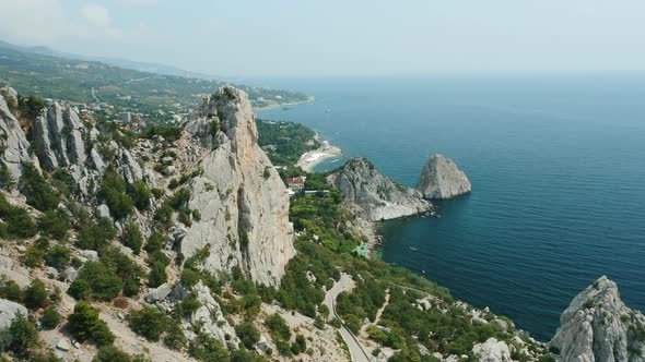 Aerial Fly Above Mountain Koshka of Simeiz with Diva Rock in Background