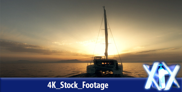 Yacht Sailing Against Sunset