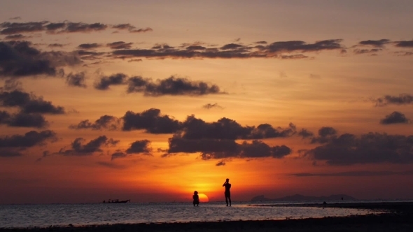 Romantic Couple Silhouette Enjoying Beach Vacation