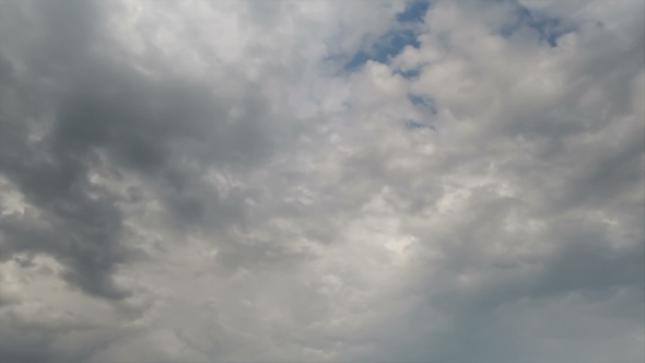 Clouds Moving In The Blue Sky alt
