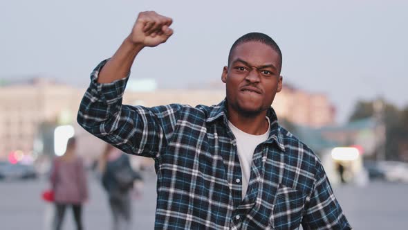 Confident Motivated Strong Power African American Mixed Race Man Guy Standing in City Pointing