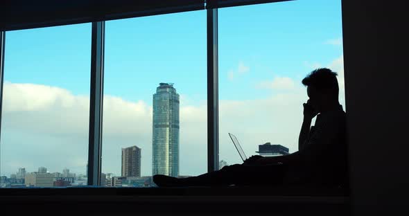 The Businessman Retired on the Windowsill for Fruitful Work