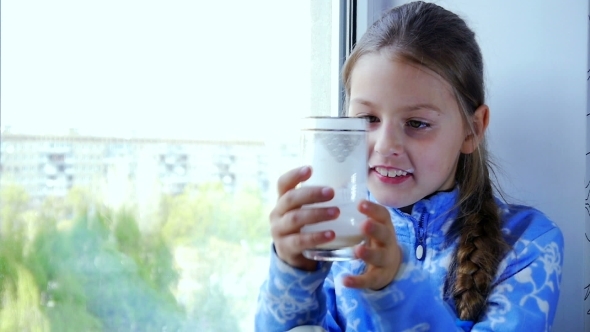 Happy Little Child Drinking Milk 