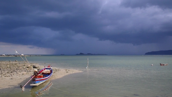 Sea And Wooden Boat On Thailand Beach - Stormy