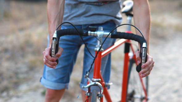 Man on a Bicycle in Park