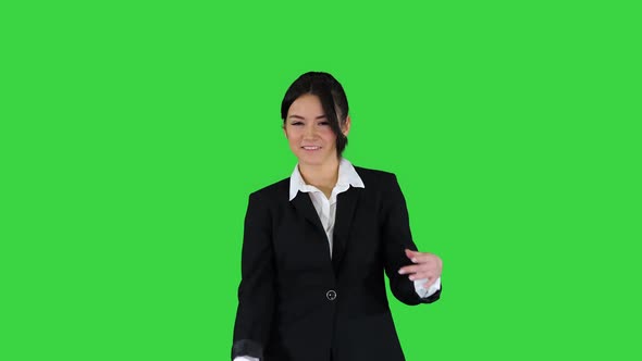 Brunette Businesswoman Dancing on a Green Screen, Chroma Key.