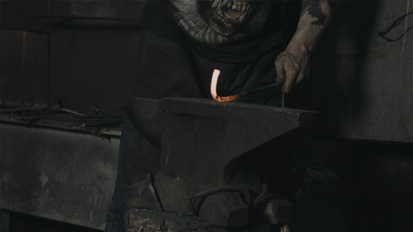 Blacksmith Hammer Hot Iron in Forge