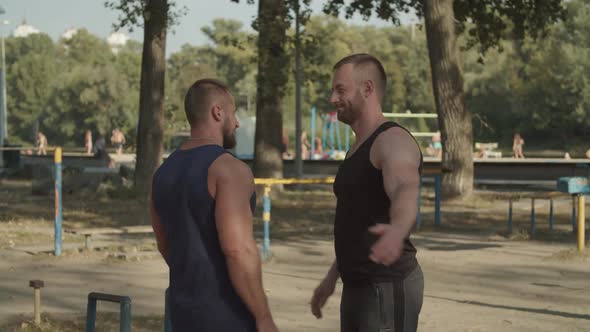 Positive Athletes Giving High Five After Workout