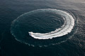 Small yacht making a circle in the water - PhotoDune Item for Sale