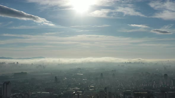 Above the clouds. Sunrise foggy morning.