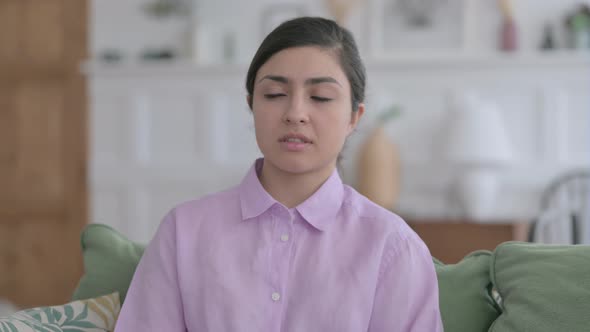 Portrait of Indian Woman Feeling Sad Sitting on Sofa