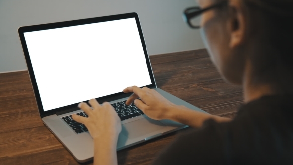 Working On Laptop On Wooden Desk