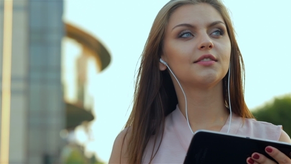 Young Girl Listening Music On Tablet alt