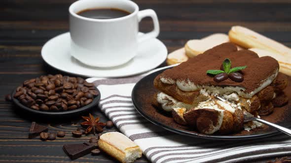 Portion of Classic Tiramisu Dessert and Savoiardi Cookies on Wooden Background