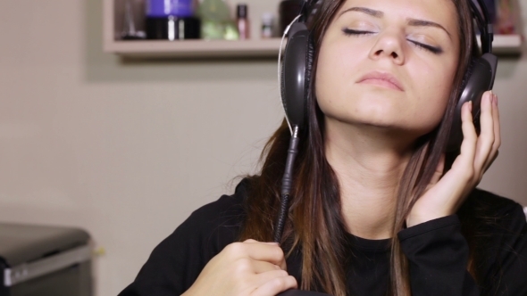 Girl With Headphones Near Table alt