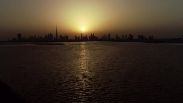 Aerial view of Dubai skyscrapers at sunset, UAE.