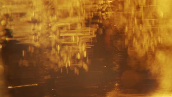 Macro Shot Of Fine Bubbles Rising in the glass of fresh beer.