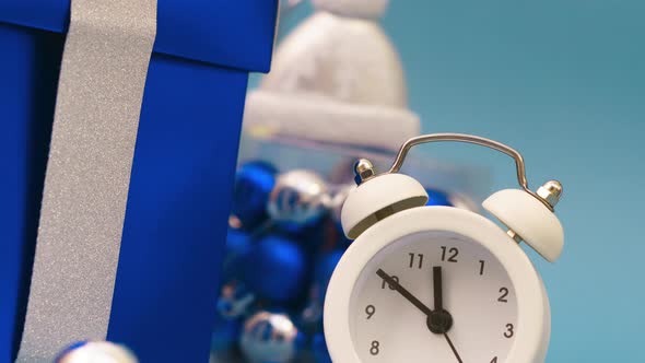 Gift Boxes with a White Alarm Clock on a Blue Background Live Greeting Card