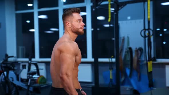 Strong athletic man in sports center. 