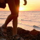 A Man Walking on the Beach at Sunset - VideoHive Item for Sale