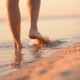 Man Goes Into The Sea Water at Sunset - VideoHive Item for Sale