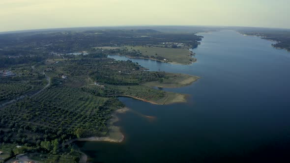 Golden Sunset Over The Large lake At The Vast Rural Area Of Alentejo