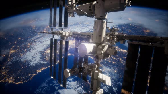 A View of the Earth and a Spaceship. ISS Is Orbiting the Earth alt