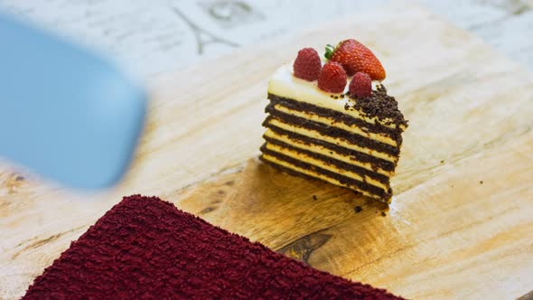 A Slice of Strawberry and Raspberry Cake and Slices Pressed with Chocolate