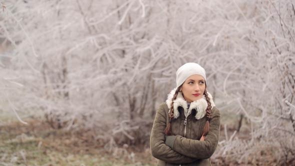 Woman Walking And Talking By Phone In Winter Time