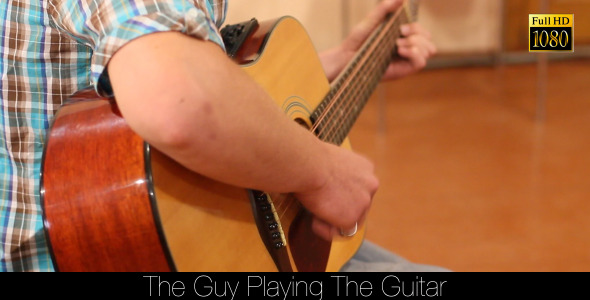 The Guy Playing The Guitar
