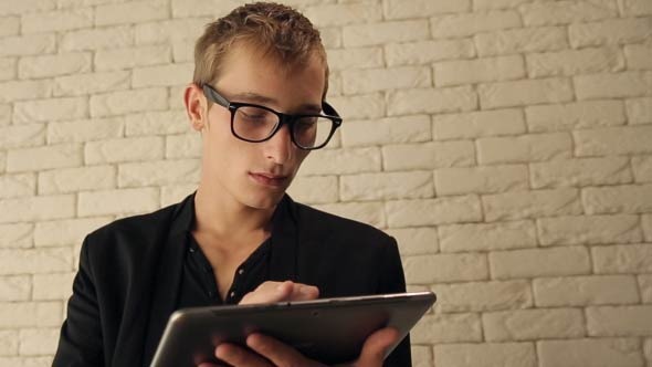 Young Man Working On A Tablet Computer