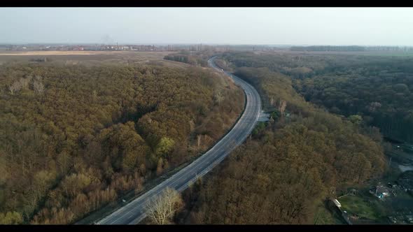 Suburban highway with a stream of cars, bird's eye view